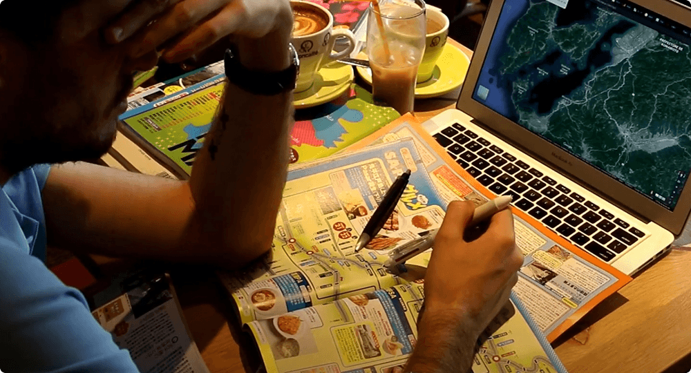 Traveller planning on laptop