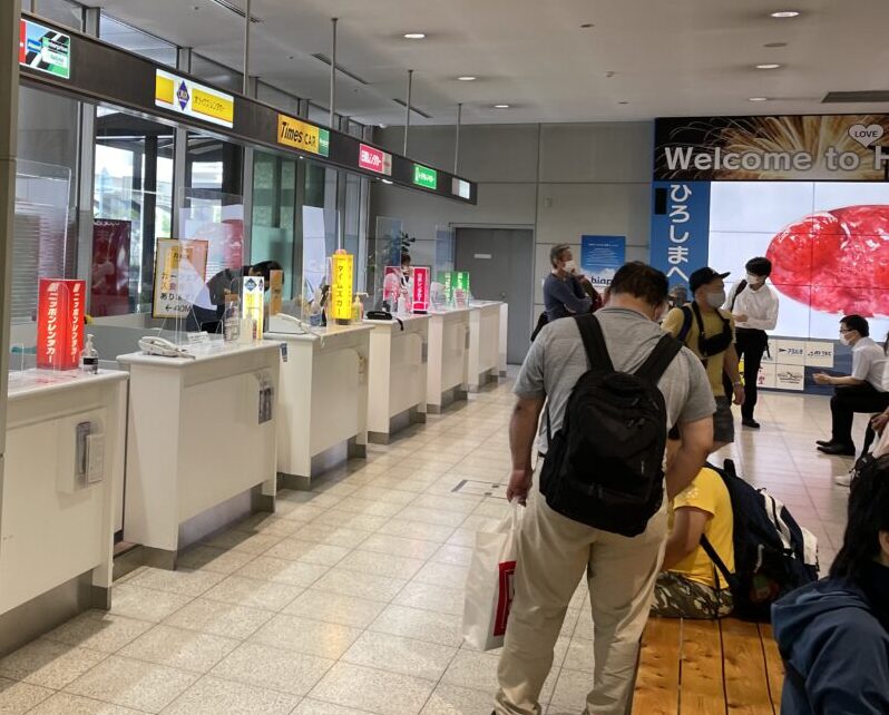 people at a rental car counter
